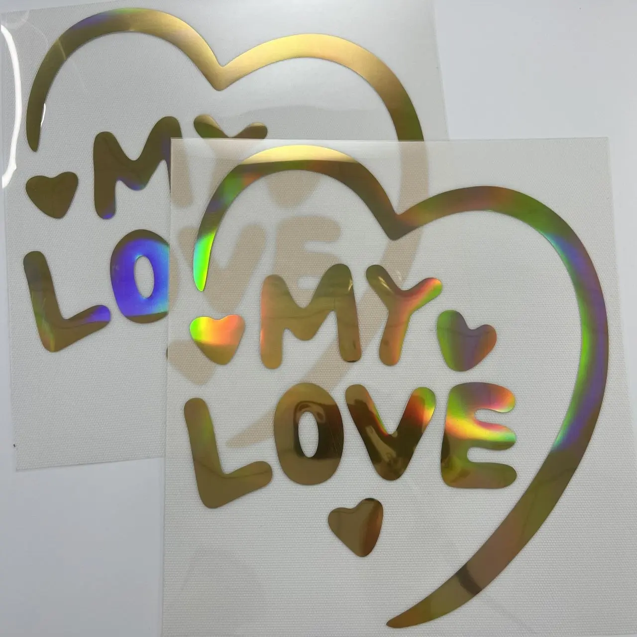 Glinsterende Gouden Ontwerpen Van Hoge Kwaliteit Op Maat Gemaakte Heat Press Sticker Transfers Afdrukken Hologram Vinyl Dtf Overdracht Voor T-Shirts