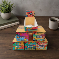 Boîtes de présentation en carton ondulé sur mesure de haute qualité, à poser sur comptoir, avec système de déchirement, pour chocolats, bonbons et gommes.