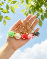 Neuer Mini Süßer Dumpling-Schlüsselanhänger mit fließendem Sand-Design, Quetschspielzeug zur Stresslinderung, bunter Taschenanhänger, 4,5x2,3cm