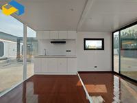 Maison préfabriquée modulaire de luxe Fengyuan, conteneur écologique extensible à énergie solaire, monté sur remorque, avec cabine coulissante