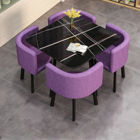 Table à Manger Ronde Moderne et Luxueuse Comprenant Quatre Chaises et une Table Basse au Design Décontracté et Gain de Place