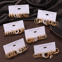 Nouvel ensemble de boucles d'oreilles créoles tendance en alliage, perles et papillons en acrylique pour femmes, bijoux creux en alliage de zinc