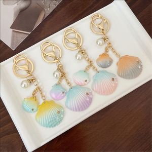 Wholesale Colorful Gradient Shell Creative Pearl Keychain, Bag Hanger, Fashion <b>Accessory</b>,Trendy Women's Keyring - Product Image 1
