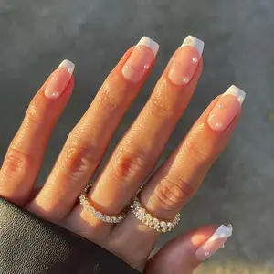 French manicure with diamonds