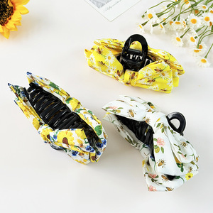 Il nuovo fermaglio per capelli a forma di girasole da donna emanava un look di alta classe. Fascia per capelli elegante e versatile da indossare sul retro della testa - Product Image 3