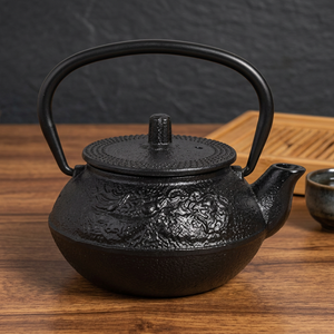 Tetera tradicional china de hierro fundido con tapa y asa, resistente al calor. - Product Image 4