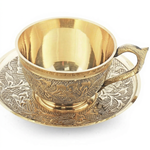 Artisan Brass <b>Cup</b> and <b>Saucer</b> with Intricate Embossed Patterns for Elegant Dining and Gifting Purposes. - Product Image 1