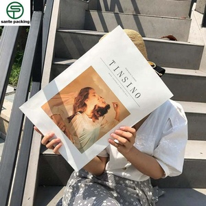 Wholesale Recyclable Die Cut Folder White Kraft Paper Bag Custom T-Shirt Clothing Packaging Bag With Logo - Product Image 6