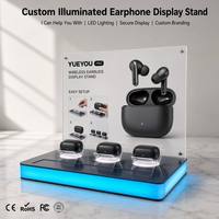 Support d'affichage pour écouteurs sans fil TWS avec base lumineuse LED, 3 zones d'affichage, panneau acrylique personnalisable, démonstration de vente au détail d'écouteurs Bluetooth