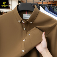 Nouvelle chemise Oxford unie à manches longues en coton haut de gamme pour homme, avec col rabattu, perles et poches, respirante, printemps/automne