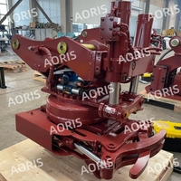 Poignées hydrauliques pour excavatrices avec support dorsal pour les opérations de défrichage