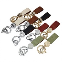 Nouveau porte-clés chic en cuir tressé en forme de patte d'ours, incrusté de diamants, style français, pour femme, breloque de sac de luxe léger pour clés de voiture
