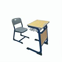 Ensemble de bureau et chaise d'école à hauteur fixe sécurisée avec panier à livres, table d'étude à structure métallique robuste, mobilier de classe économique