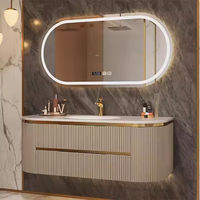 Meuble-lavabo mural de salle de bain moderne de luxe incurvé et cannelé, personnalisé pour la vente en gros, avec vasque intégrée et armoire miroir ovale à LED