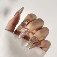 Faux ongles à presser en acrylique transparent rose nude effet œil de chat, forme amande, avec cadre doré transparent et strass ovales roses, 10 pièces pour rendez-vous
