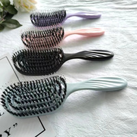 2023 boucle personnalisée démêlant brosse à cheveux moderne 12 pagaie peigne forme ovale poils de sanglier rembourré Compact bouclés pagaie Logo personnalisé