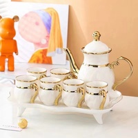 Service à thé de luxe de style nordique, moderne, en céramique dorée peinte à la main, nouveau service créatif de tasses et de carafes à café