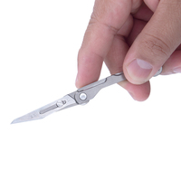 Couteau utilitaire de poche micro EDC multifonctionnel en titane pliable, petit porte-clés pendentif, pour décortiquer les colis et découper le carton