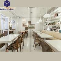 Tables de salle à manger DeliveryStone avec dessus en pierre de quartz