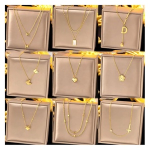 Collar ZYO de Moda para Mujer, en Acero Inoxidable con Baño de Oro de 18k, con Colgante de Zirconia en Forma de Concha, Trébol, Cruz, Mariposa, Letra y Corazón - Product Image 1