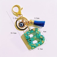 Porte-clés en résine avec pierre turquoise et feuille d'or, lettre initiale A-Z, breloque œil porte-bonheur, pompon bleu, anneau porte-clés alphabet, pendentif de sac à main, cadeau