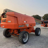 Plateforme élévatrice télescopique d'occasion JLG 660SJ, hauteur de travail 22,02 m, diesel, 4x4, tout-terrain, avec nacelle élévatrice à flèche