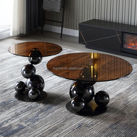 Table basse combinée en verre trempé rond avec base en acier inoxydable noir, style moderne et luxueux pour salon ou hôtel