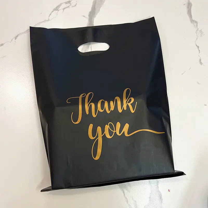 Sac d'emballage biodégradable en plastique à impression personnalisée sacs de vêtements sacs de remerciement de marchandise noire pour cadeau d'achat de boutique au détail