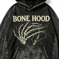 Hoodie Oversize Kornit DTG, imprimé vintage avec motif main squelette et lettres audacieuses, à plusieurs déchirures, bords bruts et coupe délavée