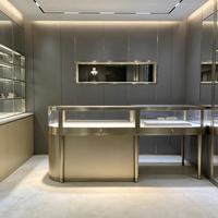 Présentoir de bijoux en or et diamant moderne de luxe Table ronde en acier inoxydable pour vitrine avec lumière LED