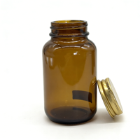 Bouteille en verre ambré avec bouchon à vis en aluminium et couvercles métalliques pour comprimés et capsules, avec scellage par induction thermique – Approvisionnement direct usine