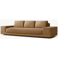 Canapé modulaire moderne à accoudoirs larges en tissu, structure en bois artisanal, coussins en mousse multi-densités, pour salon