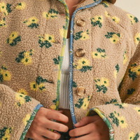 Veste en sherpa à manches longues avec imprimé floral et bordure contrastée