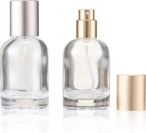 Vente en gros Bouteille de luxe en verre de parfum vide de forme ronde avec bouchon transparent en argent 30ml 50ml 100ml - Product Image 1