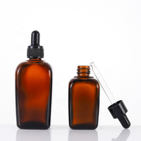 Vente en gros de flacons compte-gouttes carrés en verre ambré de 30ml Récipient d'huile essentielle de luxe avec une commande minimum de 100 pièces emballé dans des cartons