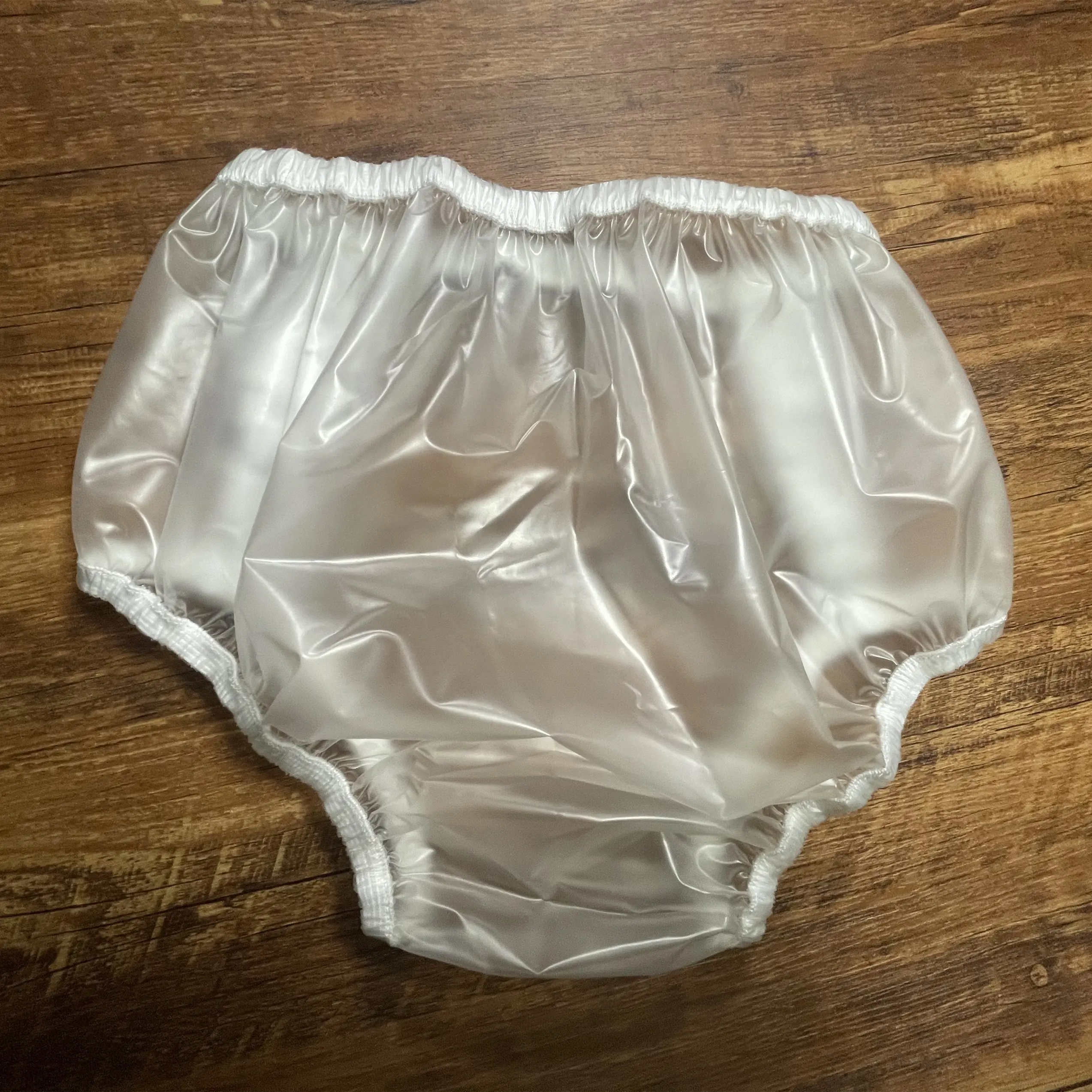 Pantaloni impermeabili per adulti pantaloni in plastica bianca lattiginosa pantaloni in plastica PVC per incontinenza