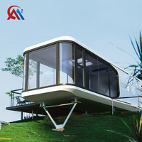 Maison capsule spatiale modulaire de conception futuriste haut de gamme avec chambre à coucher, maison triangulaire, capsule spatiale pour villa