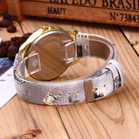 Montre analogique à quartz pour femme, style vintage, tour Eiffel de Paris, avec fleur, boîtier en alliage, verre en cristal et bracelet en cuir