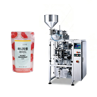 Machine industrielle verticale continue de formage, remplissage et scellage pour l'emballage de sachets à bec verseur de miel, sirop et condiments visqueux