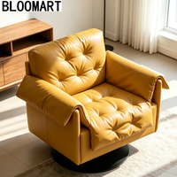 Fauteuil pivotant de luxe en cuir mélangé, rembourré de plumes, avec base pivotante en carbone noir mat