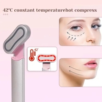 Masseur oculaire rotatif à lumière rouge avec microcourant, vibration et chauffage pour les cernes et le massage facial