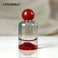 Bouteilles de parfum en verre vides rondes de 30 ml, 50 ml, 100 ml avec logo personnalisé d'usine, design volcan rouge et bouchon sphérique rouge