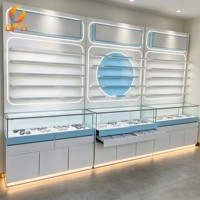 Vitrine optique murale moderne avec éclairage LED, présentoir à lunettes avec comptoir en verre pour magasin d'optique