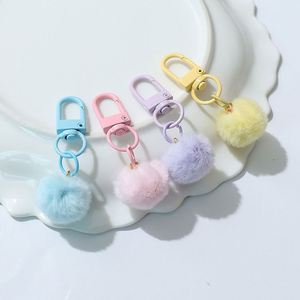 พวงกุญแจลูกบอลน่ารักสีลูกกวาด  พร้อมเคสใส่หูฟัง  ของตกแต่งกระเป๋า  งานแฮนด์เมด  ของตกแต่งประตู  ผลิตจากโรงงาน - Product Image 1