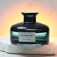 Diffuseur d'arômes rond noir de luxe de 180 ml avec bouchon en liège et roseau, design élégant, populaire dans un emballage en carton
