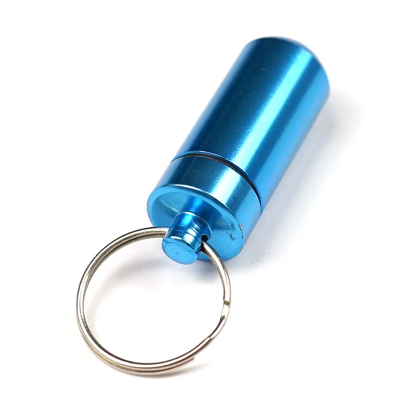 Mini contenitore portatile per pillole in metallo in lega di alluminio a forma di capsula impermeabile con logo personalizzato