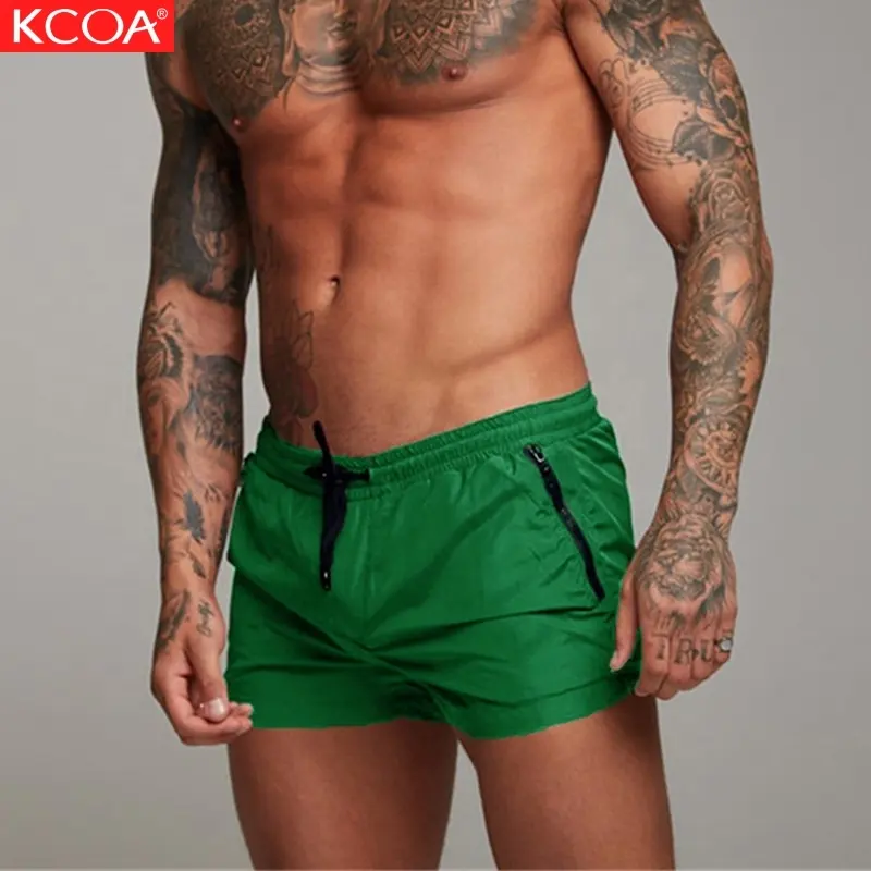 Bajo Precio de color verde de los hombres ropa de playa con bolsillo