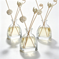 Flacon d'aromathérapie en verre transparent de luxe personnalisé de 100 ml avec bâtonnets diffuseurs et impression sérigraphique