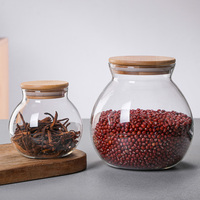 Bouteille de stockage sphère en borosilicate fabriquée à la main en gros réservoir en verre avec couvercle en liège pot de stockage rond en verre