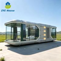 Capsule spatiale intelligente de 20 pieds avec 1 chambre, cuisine, salon et balcon pour la famille, idéale pour les jardins et les centres de glamping